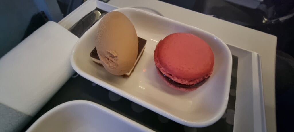 Close-up of Brussels Airlines business class dessert with a red macaron and a chocolate mousse on a short-haul flight from Brussels to Manchester.