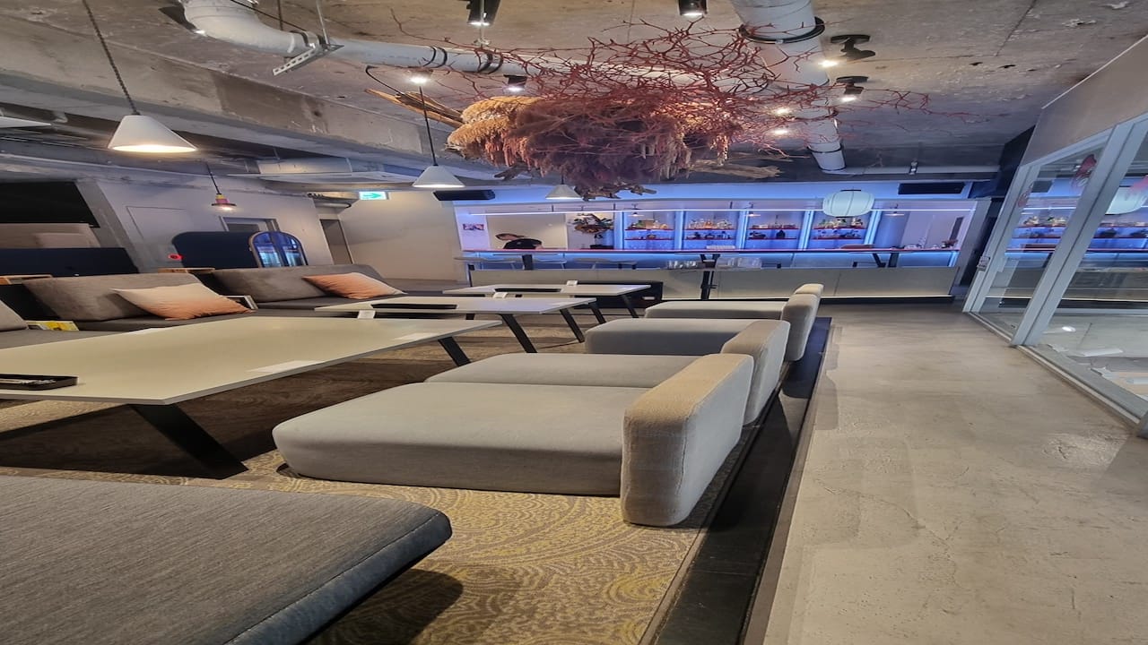 Artist-designed lounge and bar area inside the BnA Wall Art Hotel in Tokyo