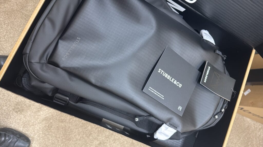 Close up of 30L backpack fabric texture and branding tag inside the box