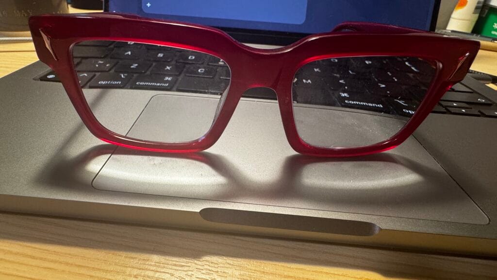 Front view of unique funky glasses frames with oversized geometric red design