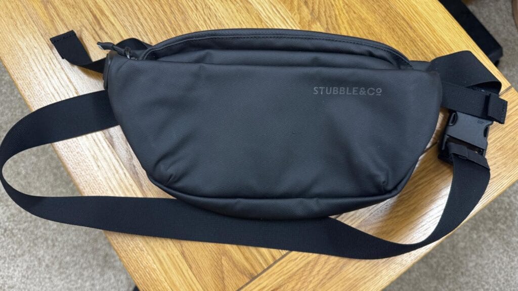 Stubble & Co crossbody travel sling bag front view on table