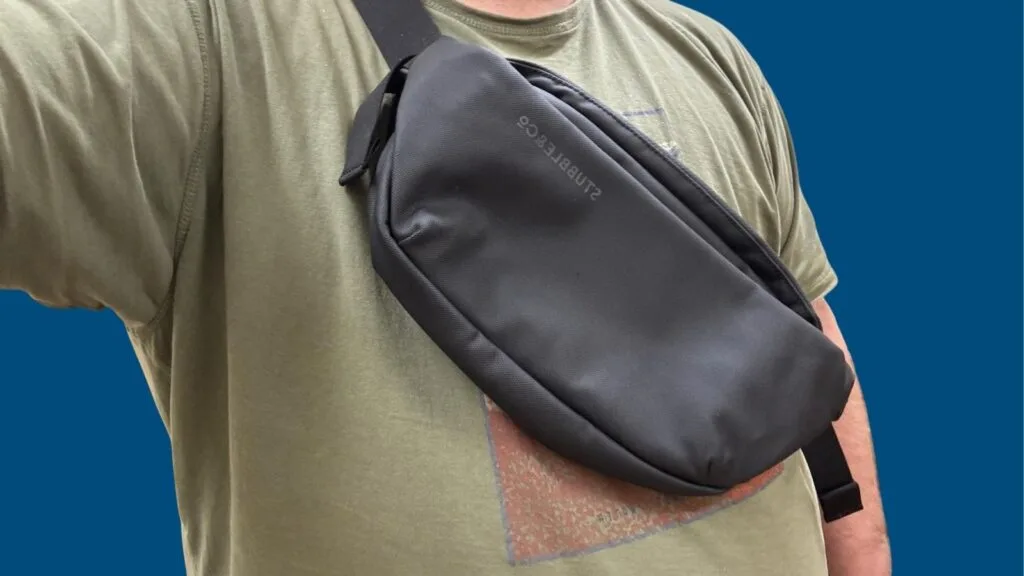 Stubble & Co crossbody travel sling bag worn across chest during travel review