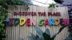 Hidden Garden Vigan “Discover the Place” sign on bamboo wall
