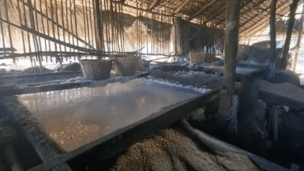 Salt making process inside a hut in Pasuquin and Burgos, Ilocos Norte using rice husks and coconut husks to evaporate seawater