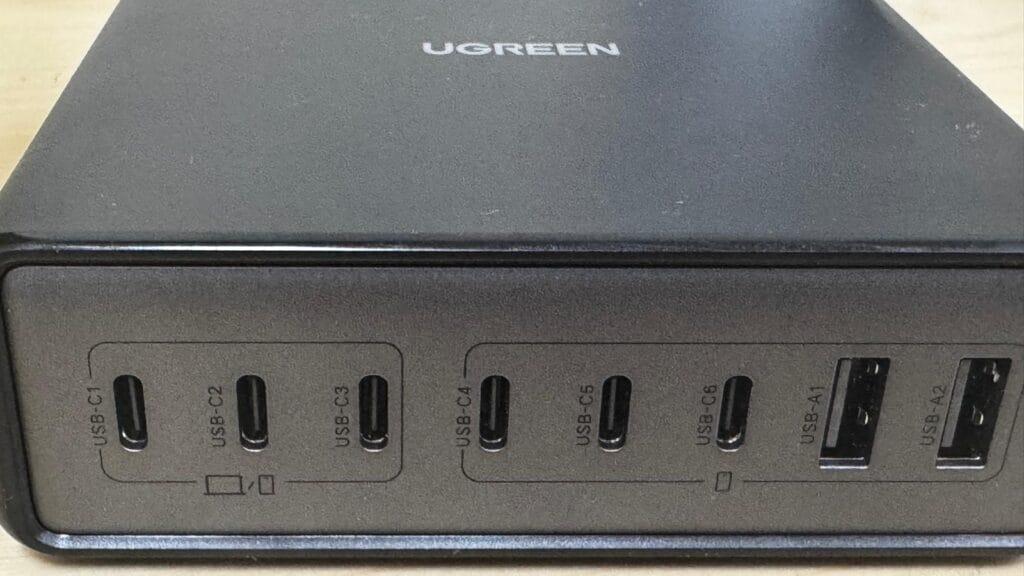 Detailed front panel view of UGREEN 8‑port charger showing port labels