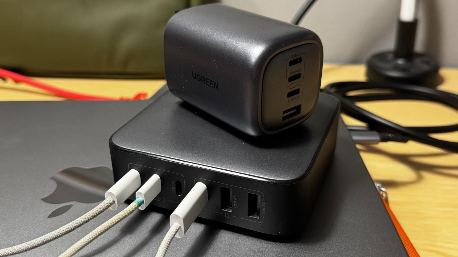UGREEN multi‑port GaN charger with smaller GaN wall charger placed on top