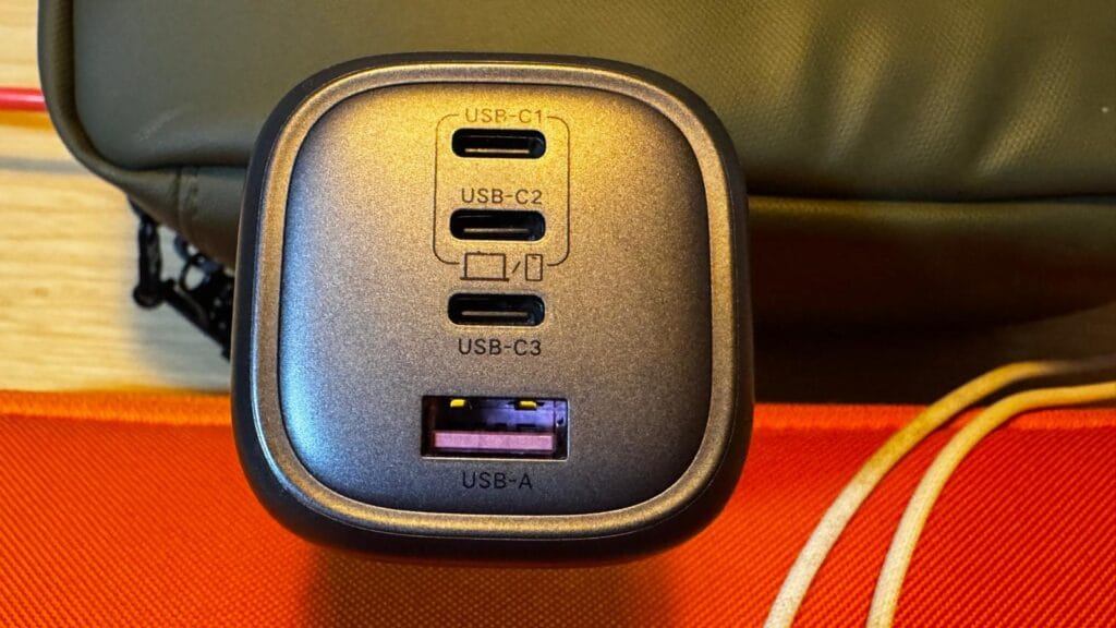Close-up of UGREEN charger showing USB‑C and USB‑A output ports