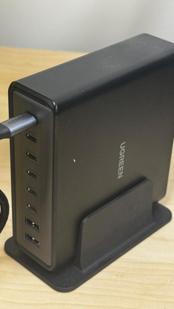 Vertical close-up of UGREEN charging station USB‑C and USB‑A port layout
