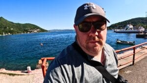 Solo traveller beside the Bay of Kotor during a Montenegro road trip