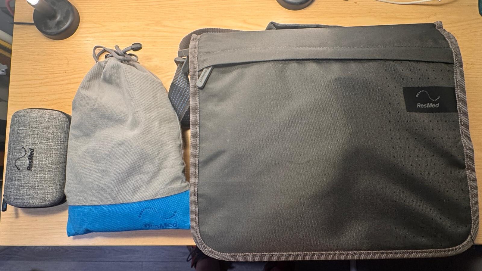 CPAP airline policy: ResMed AirMini case, drawstring bag and ResMed AirSense 10 travel bag packed as carry-on