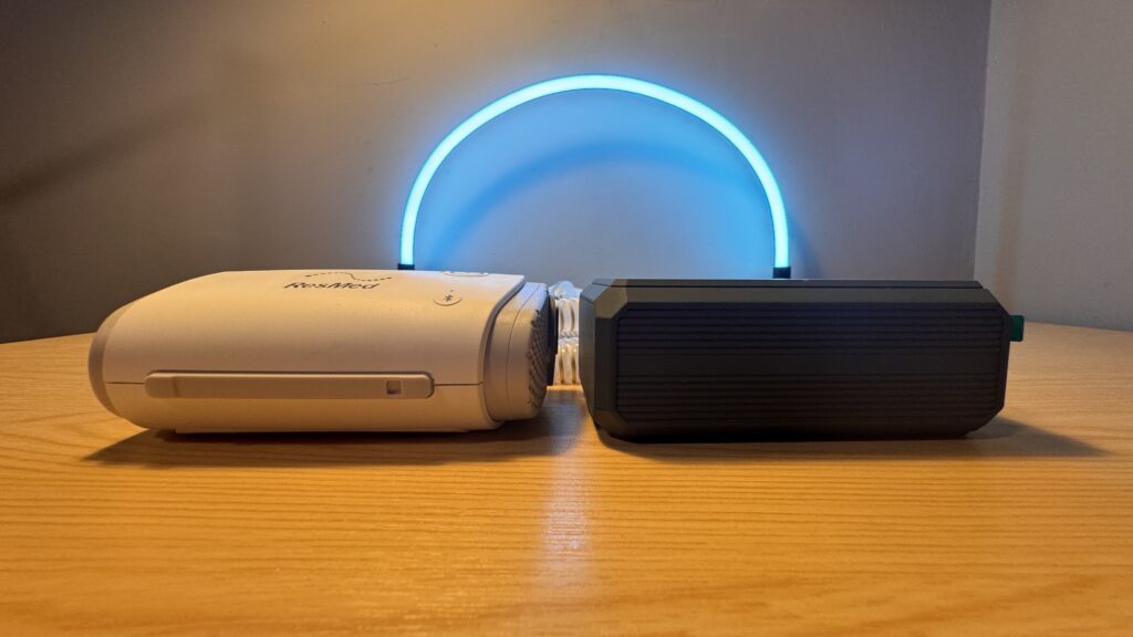 Easylonger ES270 battery beside a ResMed AirMini, showing their similar size